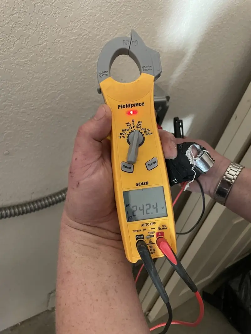 Voltage testing with clamp meter during Whole House Surge Protector in Elizabethtown